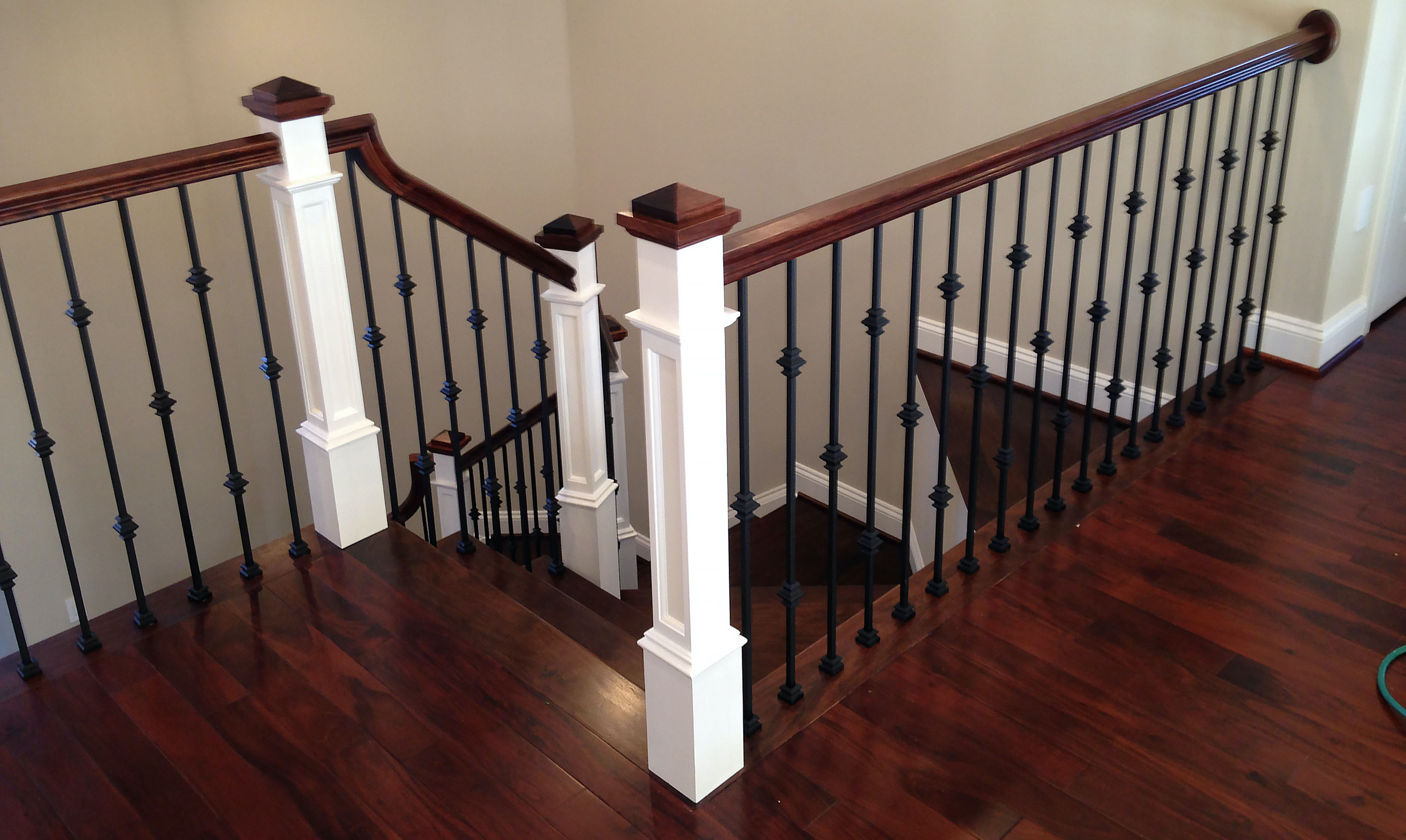 staircase and railing with landing looking from top of steps